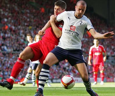 Alan Hutton up against Liverpool's Steven Gerrard