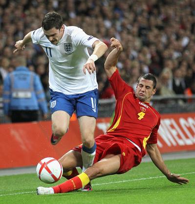 Adam Johnson in action for England against Montenegro