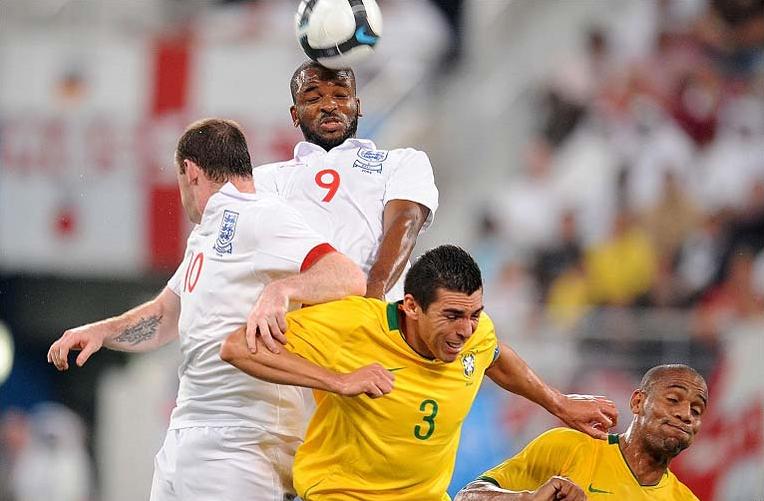 Darren Bent & Wayne Rooney in acton for England against Brazil in Qatar